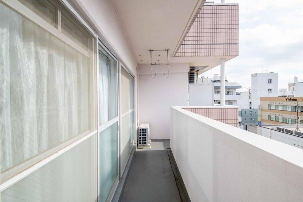 Balkón nebo terasa v ubytování 横須賀アロハハウス702