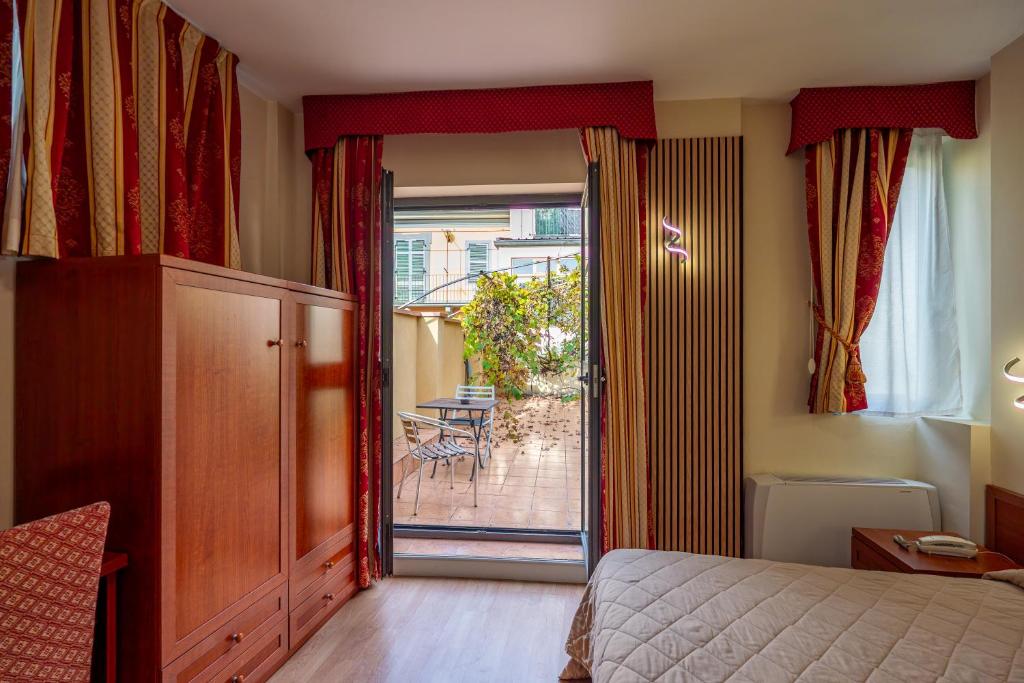 Postel nebo postele na pokoji v ubytování Hotel Cavour Resort