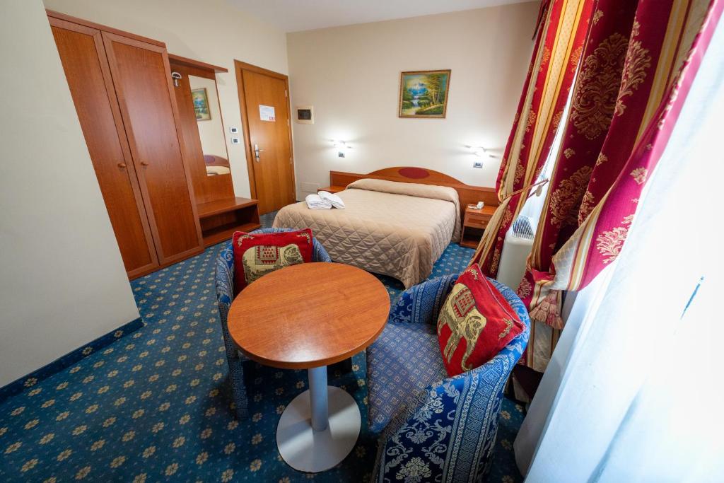 Postel nebo postele na pokoji v ubytování Hotel Cavour Resort