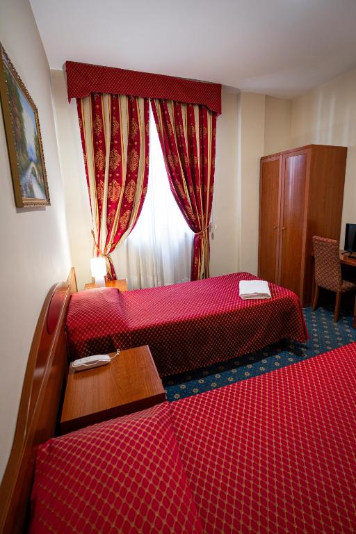 Postel nebo postele na pokoji v ubytování Hotel Cavour Resort