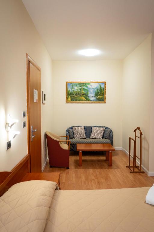 Postel nebo postele na pokoji v ubytování Hotel Cavour Resort