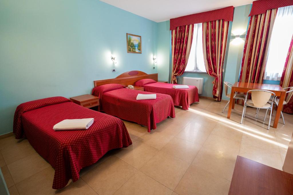 Postel nebo postele na pokoji v ubytování Hotel Cavour Resort