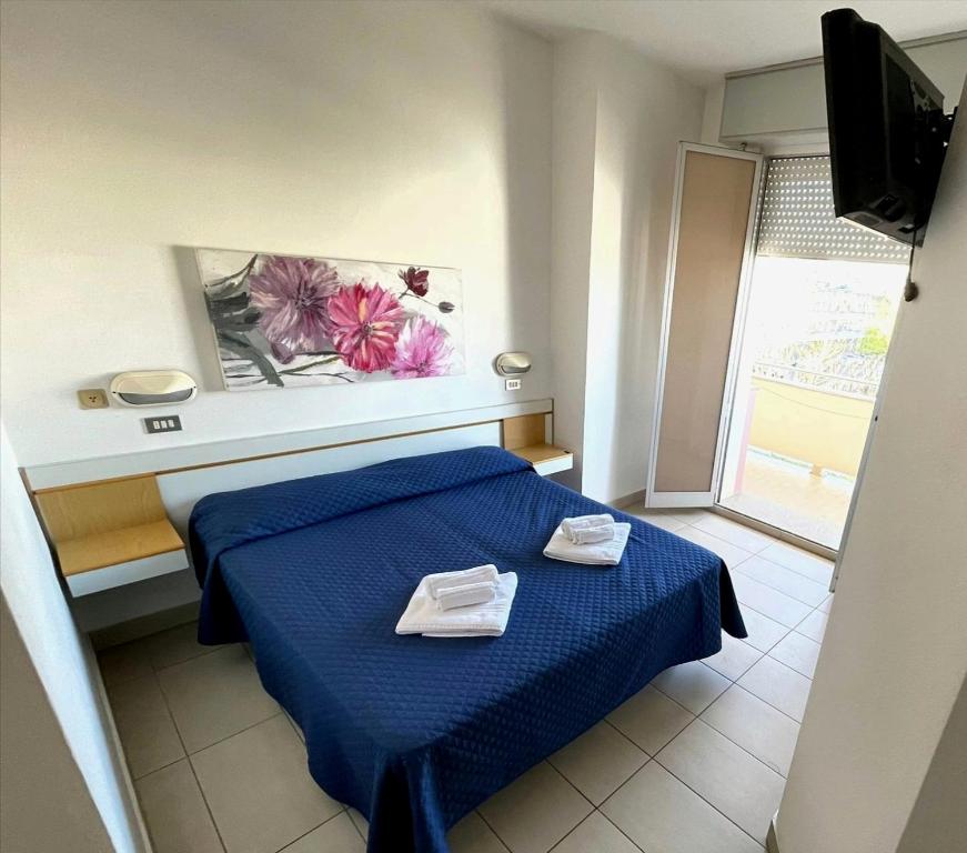 Postel nebo postele na pokoji v ubytování Hotel Alba D'Oro
