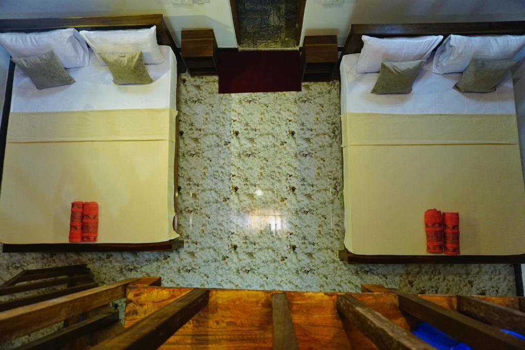 Postel nebo postele na pokoji v ubytování Sky Villa Sigiriya