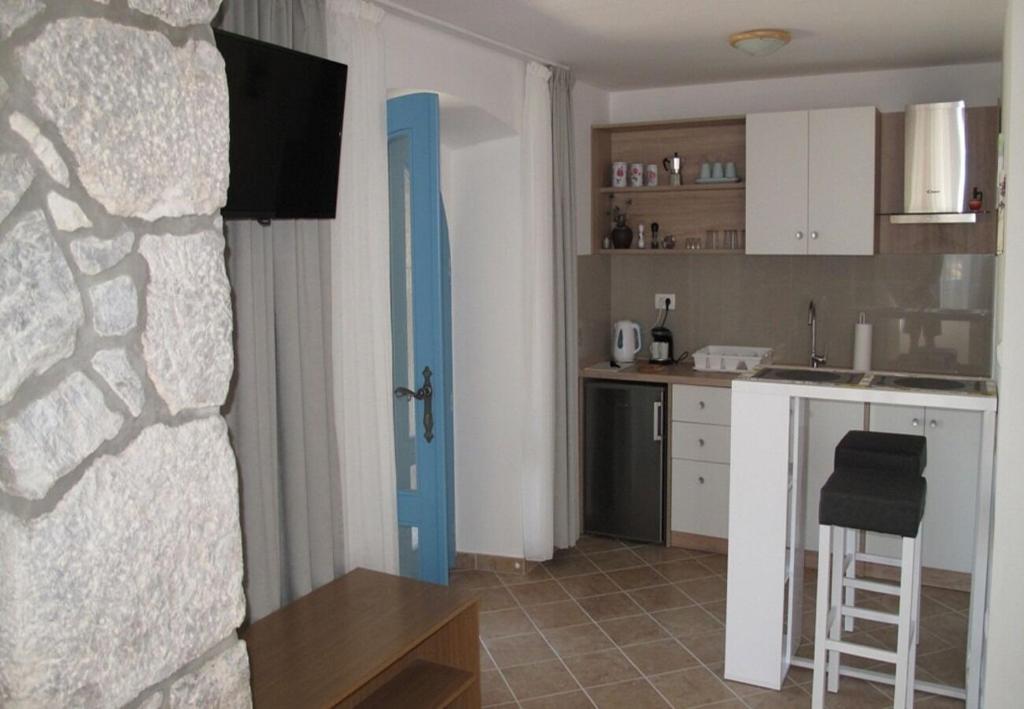 Kuchyň nebo kuchyňský kout v ubytování Apartments Insula Insule