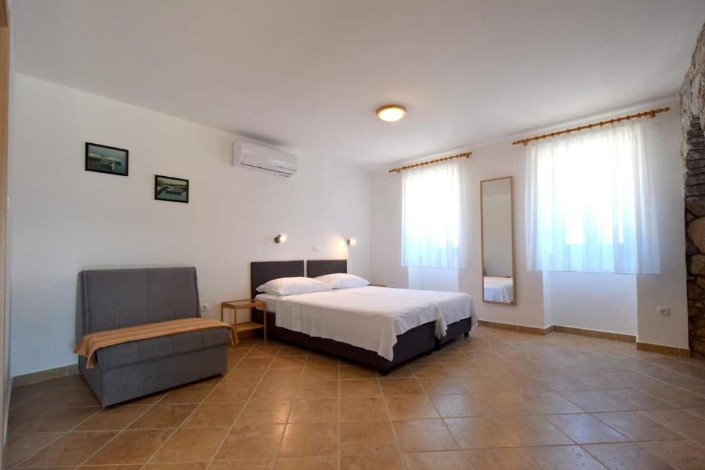 Postel nebo postele na pokoji v ubytování Apartments Insula Insule