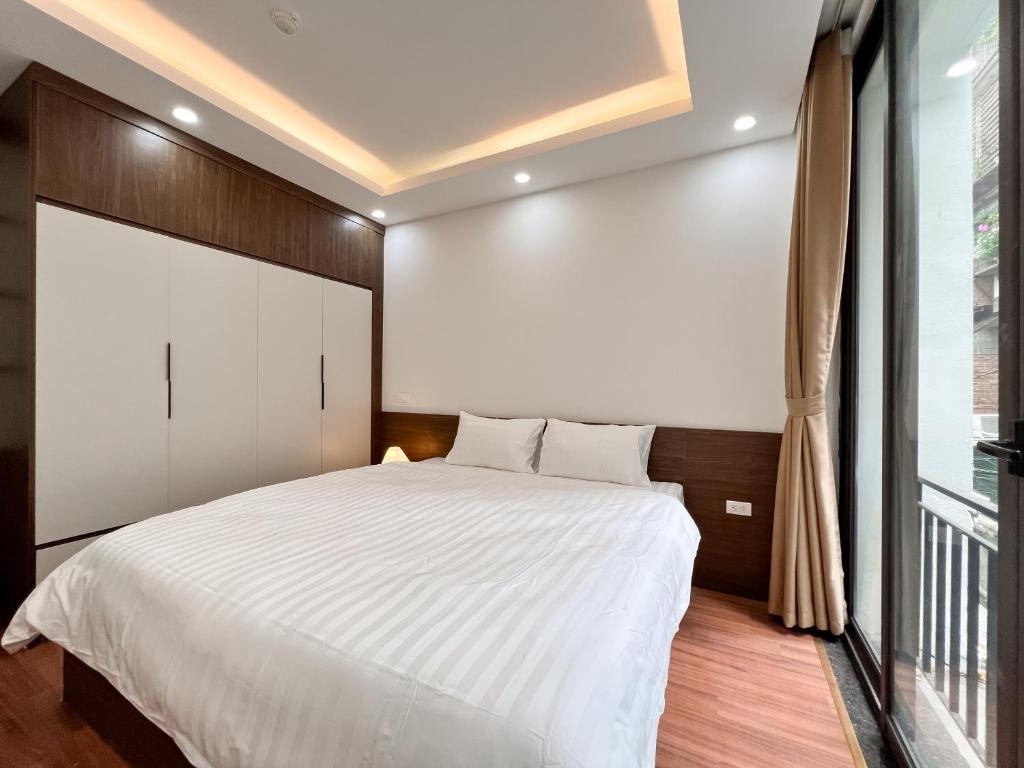 Postel nebo postele na pokoji v ubytování NINE HOUSING 49 Linh Lang