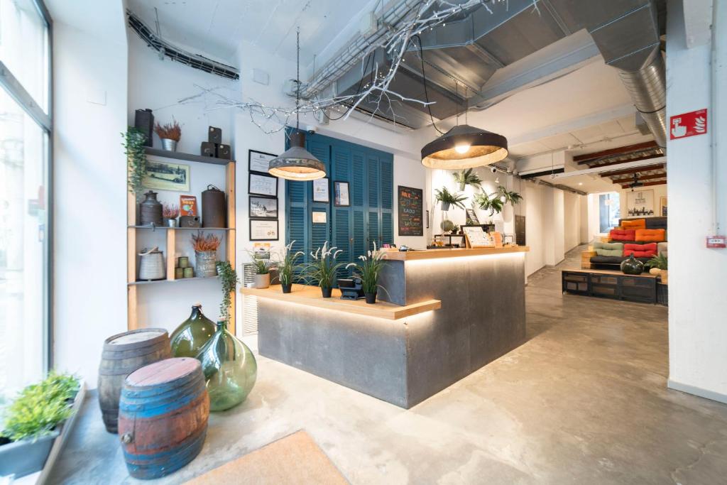 a lobby of a store with potted plants at Koba Hostel in San Sebastián
