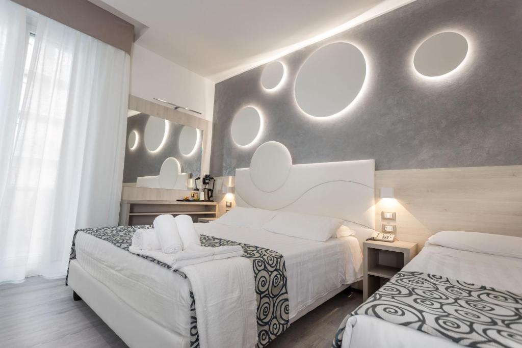 Postel nebo postele na pokoji v ubytování Hotel Nettuno