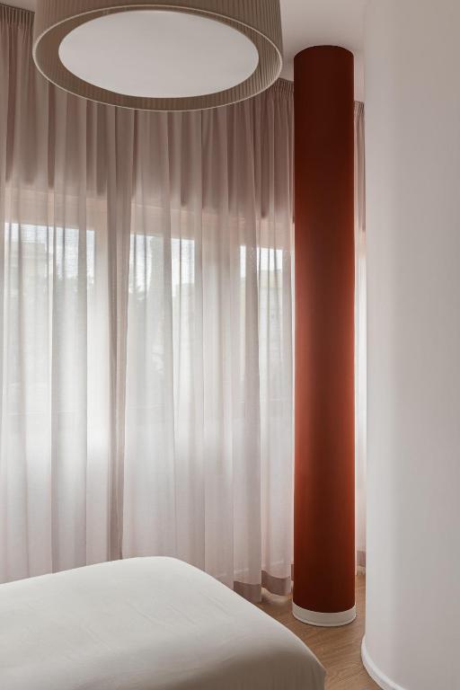 Postel nebo postele na pokoji v ubytování 4BNB - Suites del Gallo