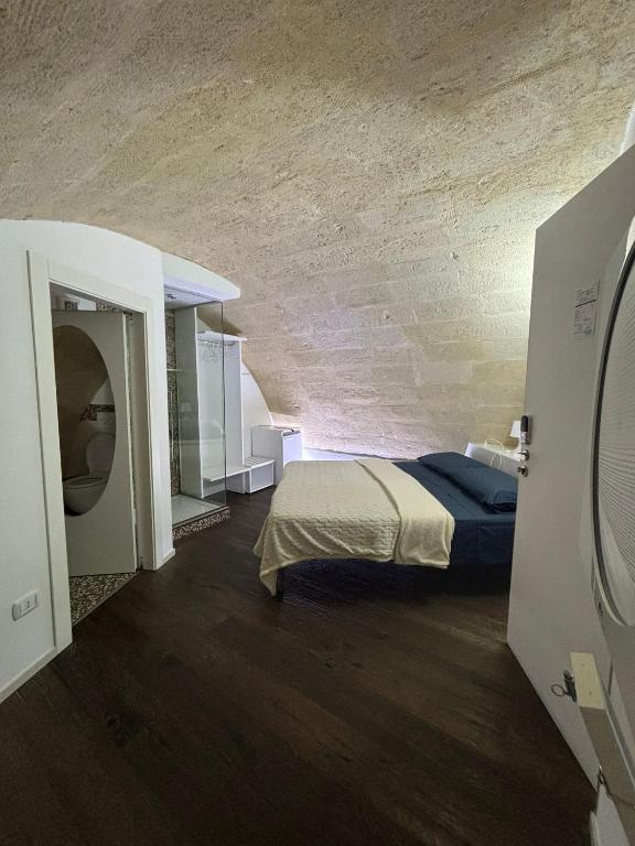 Postel nebo postele na pokoji v ubytování A spasso nel tempo