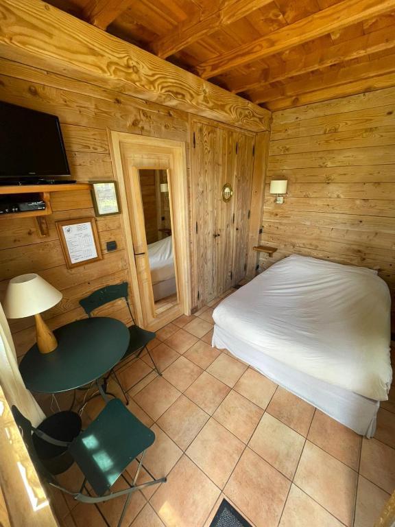 Postel nebo postele na pokoji v ubytování Auberge Les Myrtilles