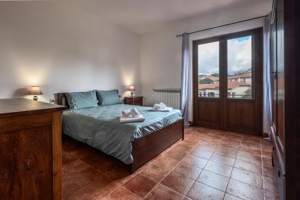 Giường trong phòng chung tại Casa Doriana