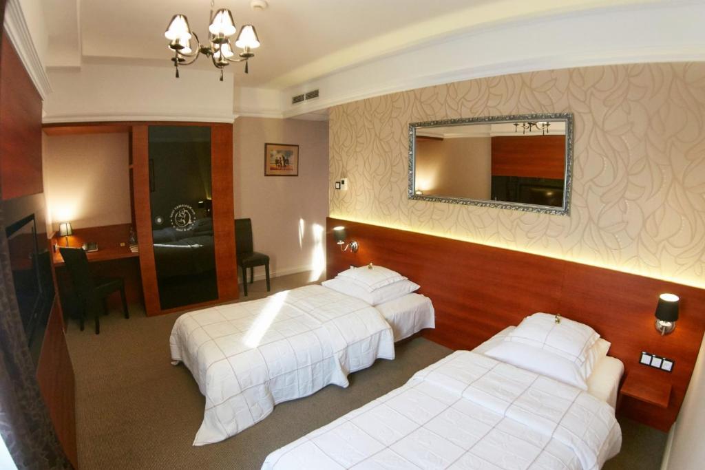 Postel nebo postele na pokoji v ubytování Hotel&Spa Kameleon