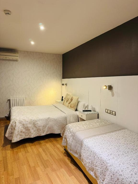 Postel nebo postele na pokoji v ubytování Hotel El Acebo