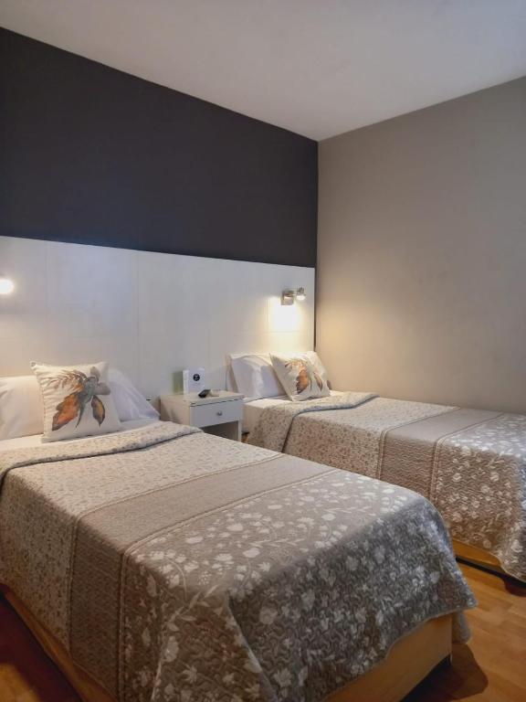 Postel nebo postele na pokoji v ubytování Hotel El Acebo