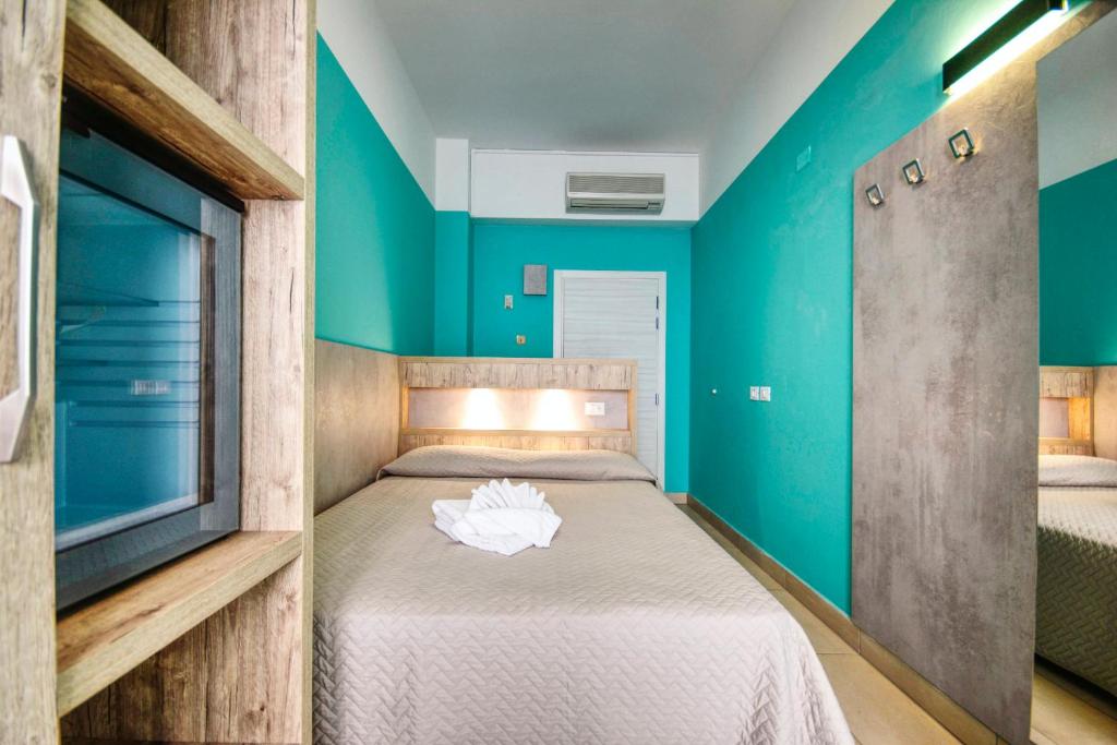 Postel nebo postele na pokoji v ubytování Hotel Alba D'Oro