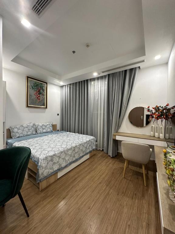 a bedroom with a bed and a desk at QM House 08 in Hanoi