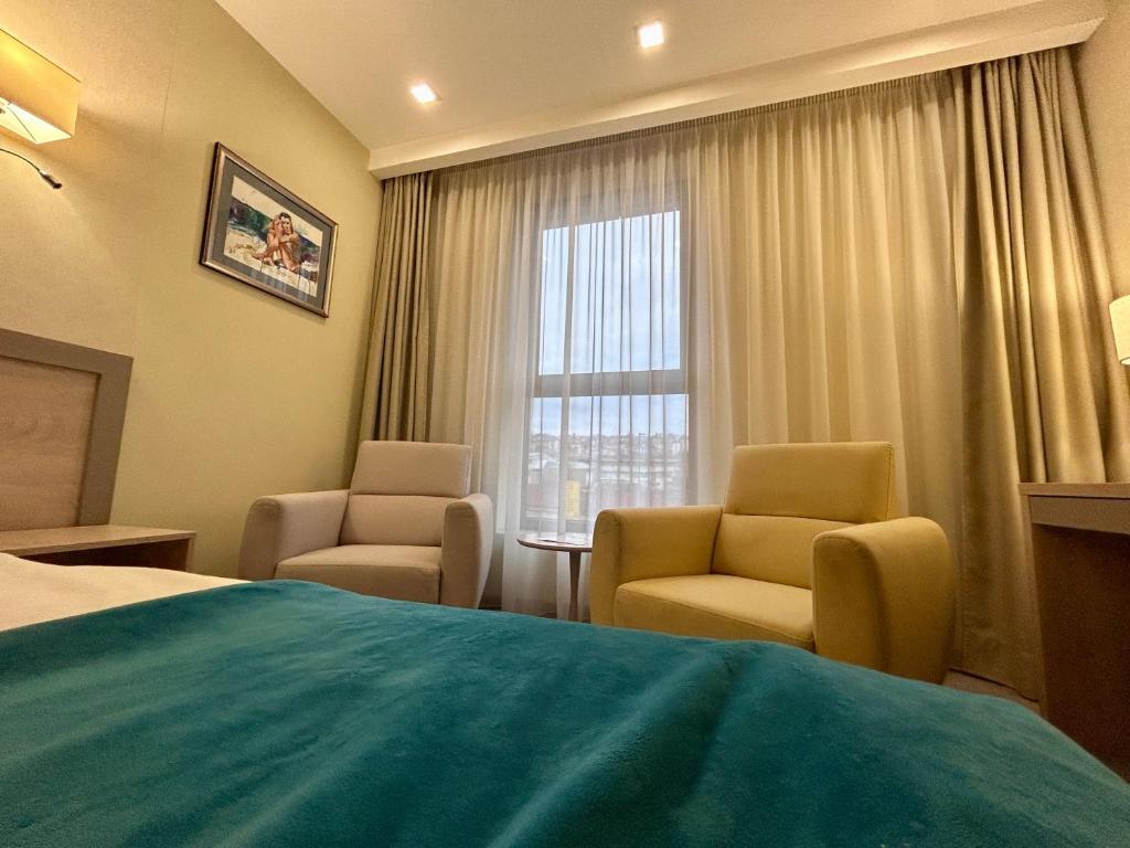 Ein Sitzbereich in der Unterkunft Hotel Siesta