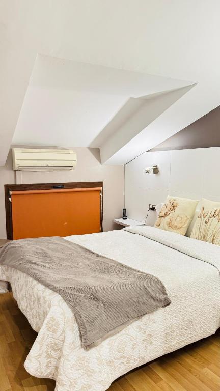 Postel nebo postele na pokoji v ubytování Hotel El Acebo