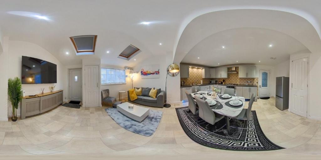 a large kitchen and living room with a dining table at Spacious 5B Sunderland Home for Groups & Families in Sunderland