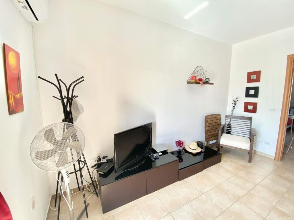 TV a/nebo společenská místnost v ubytování Isca Calabretta Apartments M2
