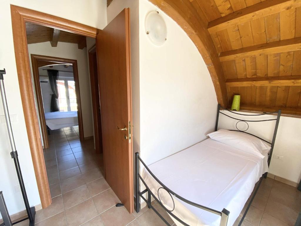 Postel nebo postele na pokoji v ubytování Isca Calabretta Apartments M2