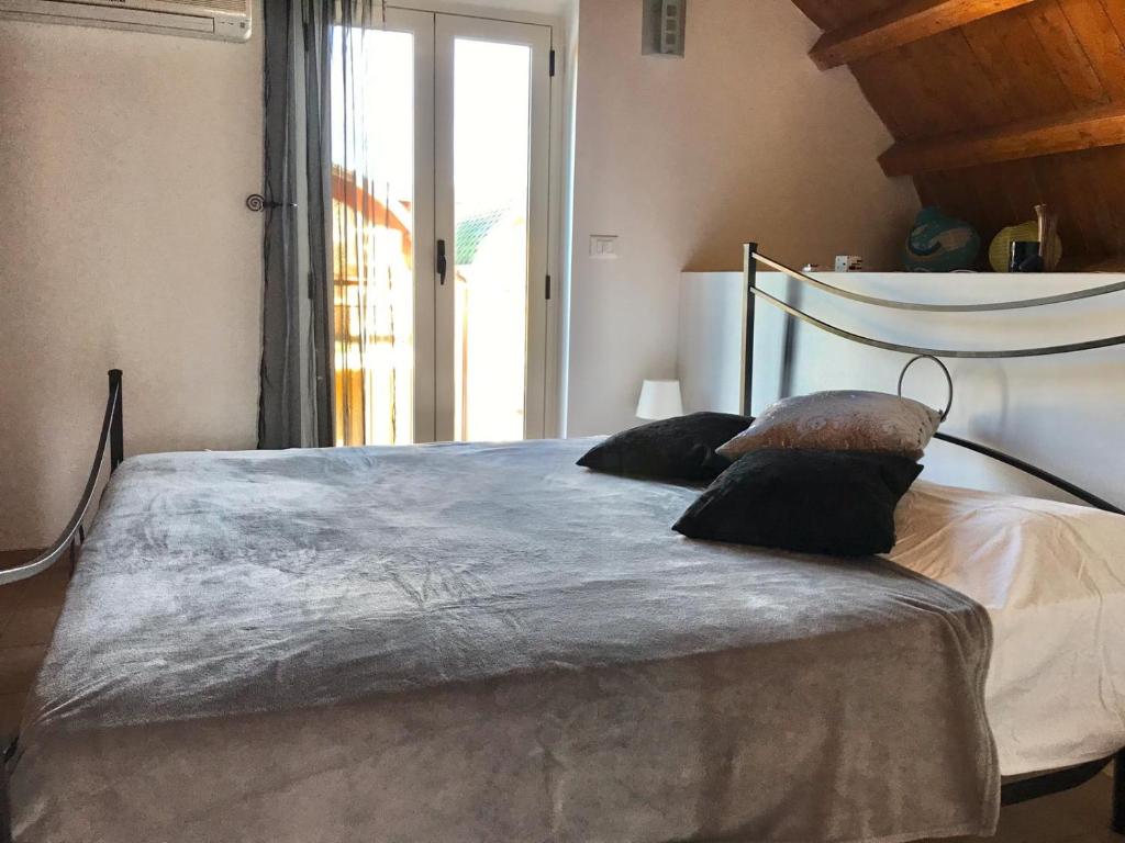Postel nebo postele na pokoji v ubytování Isca Calabretta Apartments M2