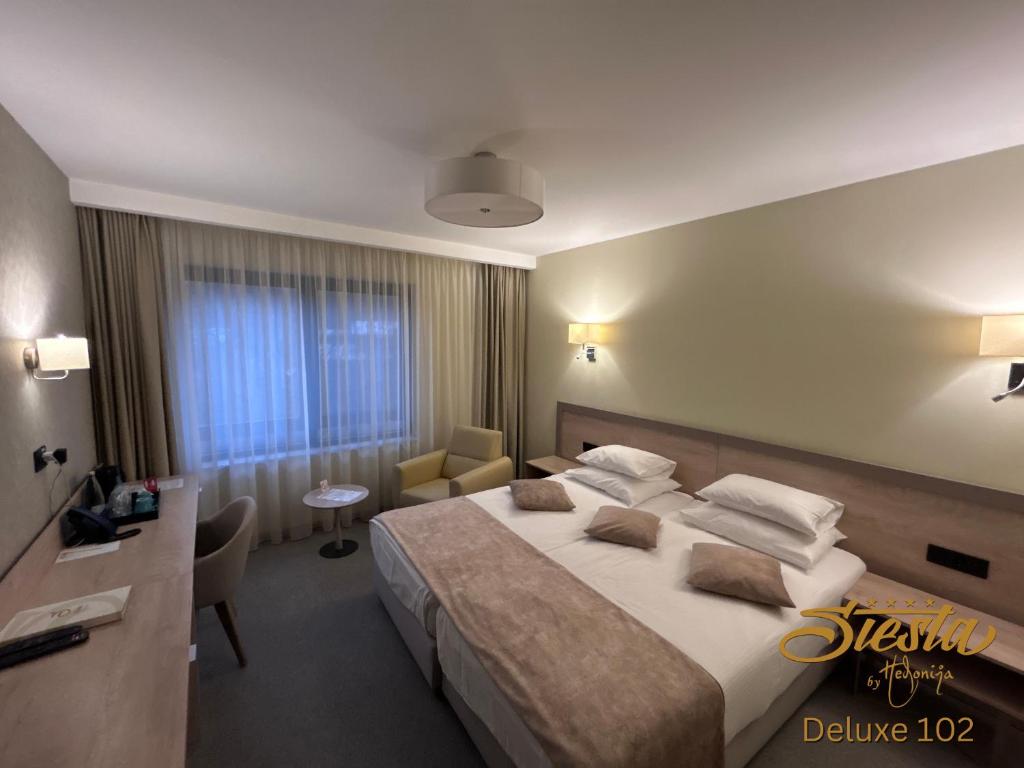 Postel nebo postele na pokoji v ubytování Hotel Siesta