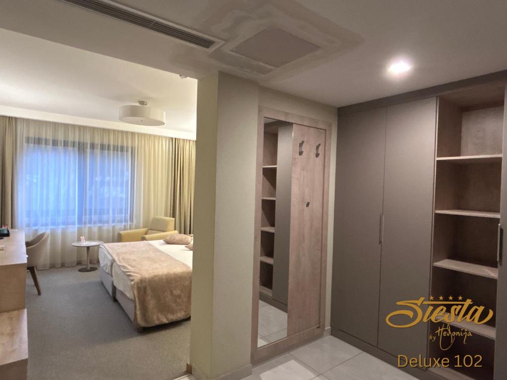 Postel nebo postele na pokoji v ubytování Hotel Siesta