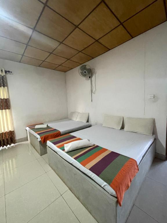 Postel nebo postele na pokoji v ubytování Gangula Resort