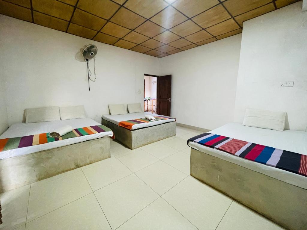 Postel nebo postele na pokoji v ubytování Gangula Resort