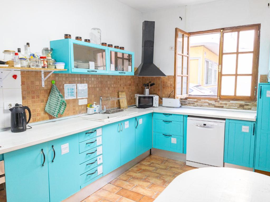 Kuchyň nebo kuchyňský kout v ubytování Puerto Nest Hostel
