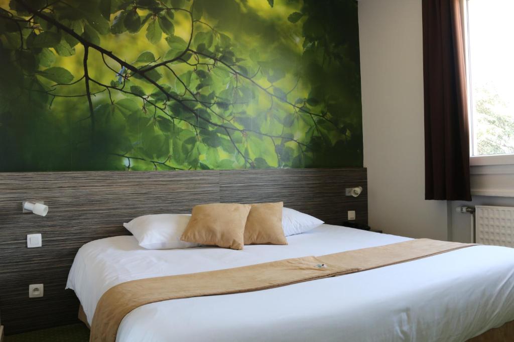 Postel nebo postele na pokoji v ubytování The Originals City, Hôtel Dau Ly, Lyon Est