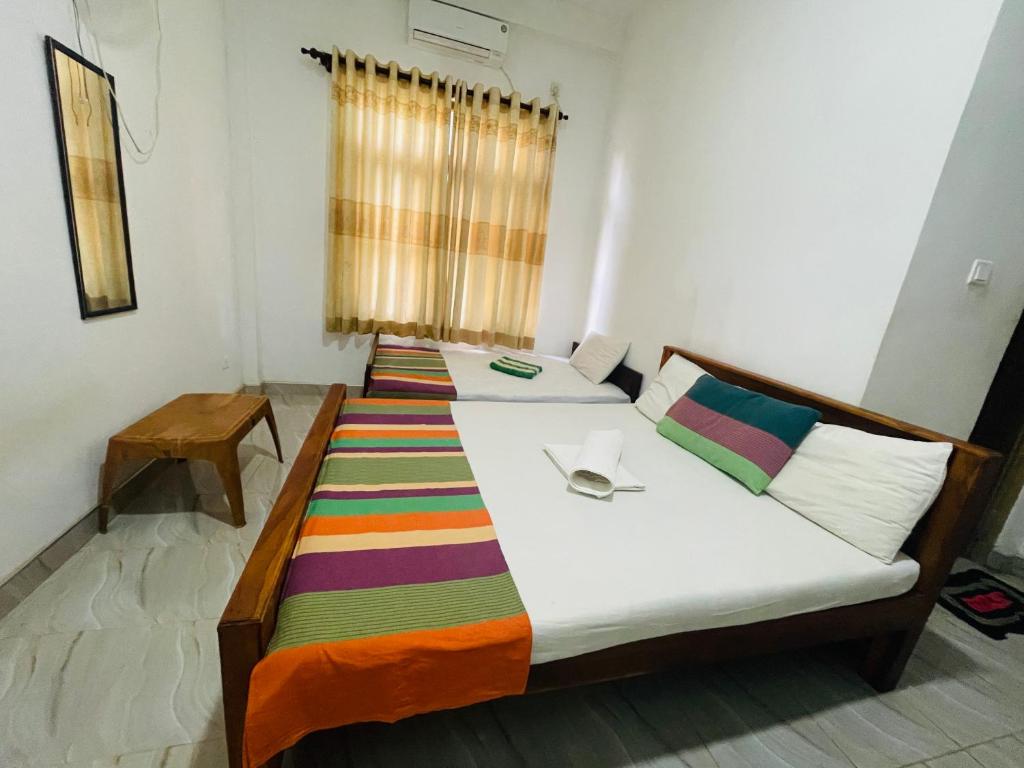 Postel nebo postele na pokoji v ubytování Gangula Resort