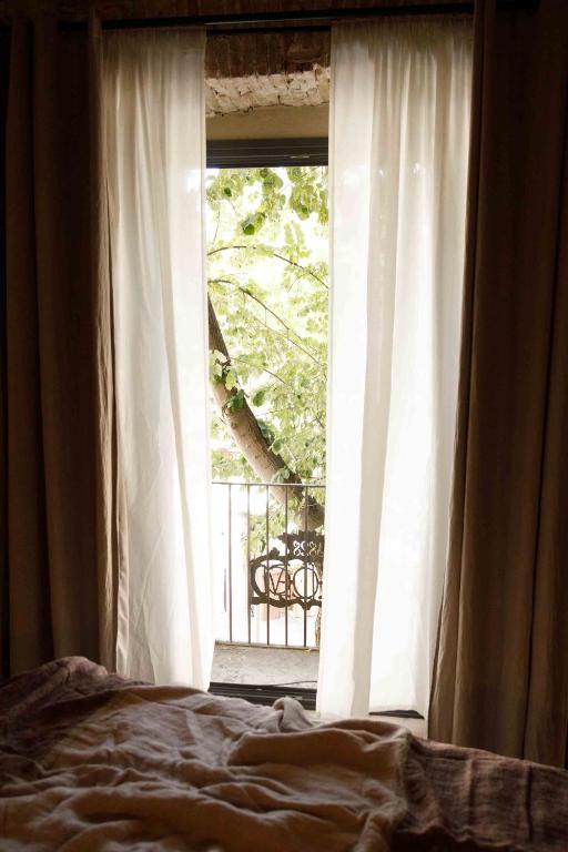 Postel nebo postele na pokoji v ubytování La Comuna by Bon Dia Residences