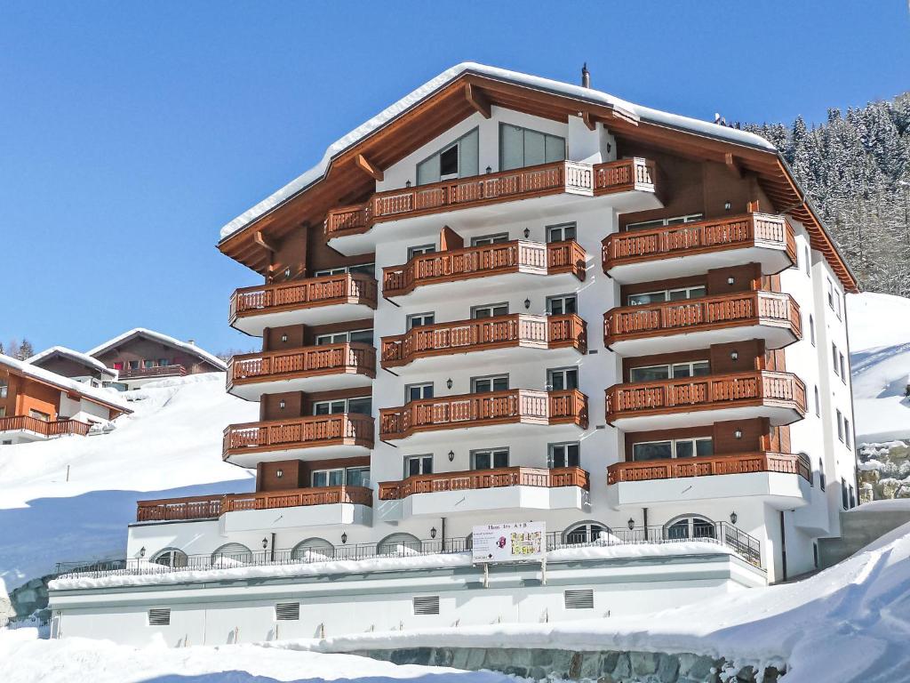 a building with snow in front of it at Apartment B21 by Interhome in Leukerbad