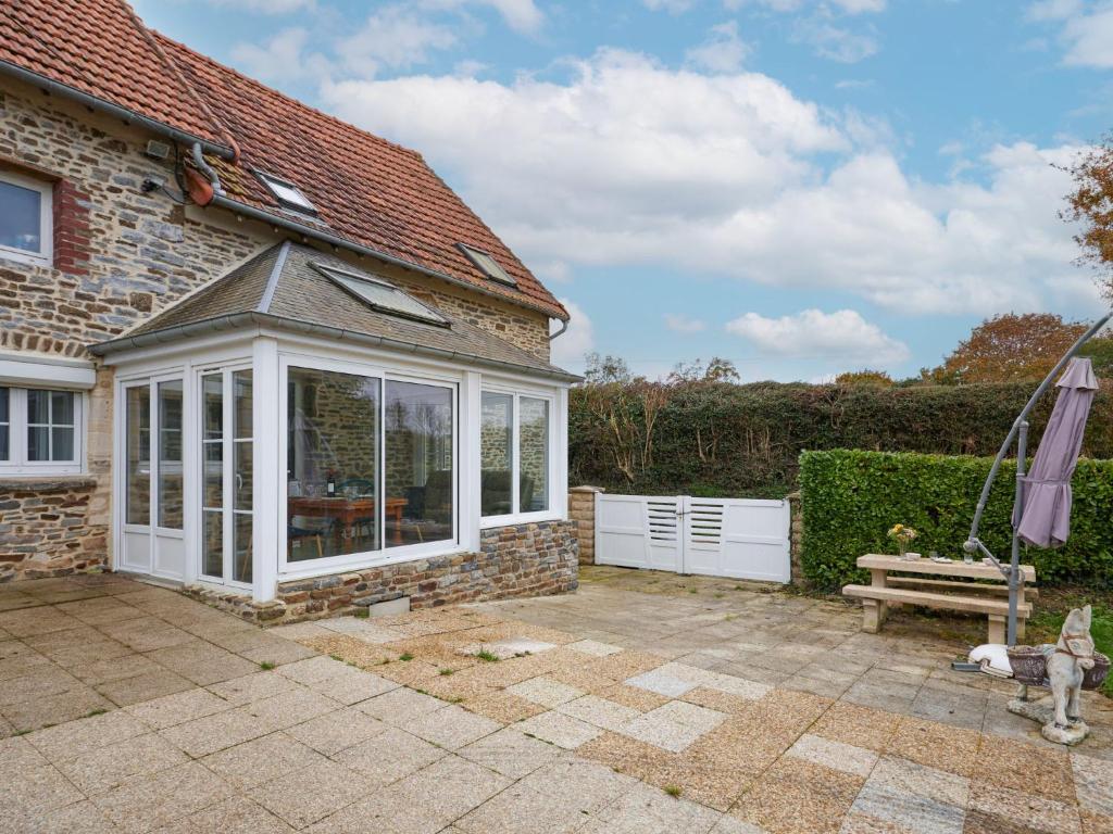 a extension to a house with a conservatory at Holiday Home Le Rouge gorge by Interhome in Saint-Lo-dʼOurville