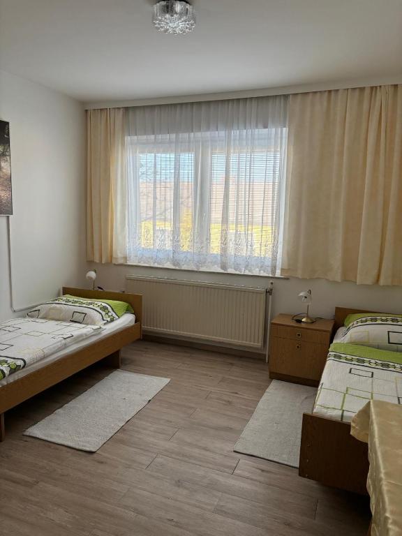 Postel nebo postele na pokoji v ubytování Pension Eicher
