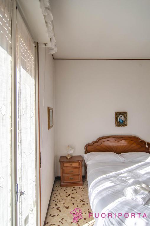 Posteľ alebo postele v izbe v ubytovaní Incantevole Residenza Retro