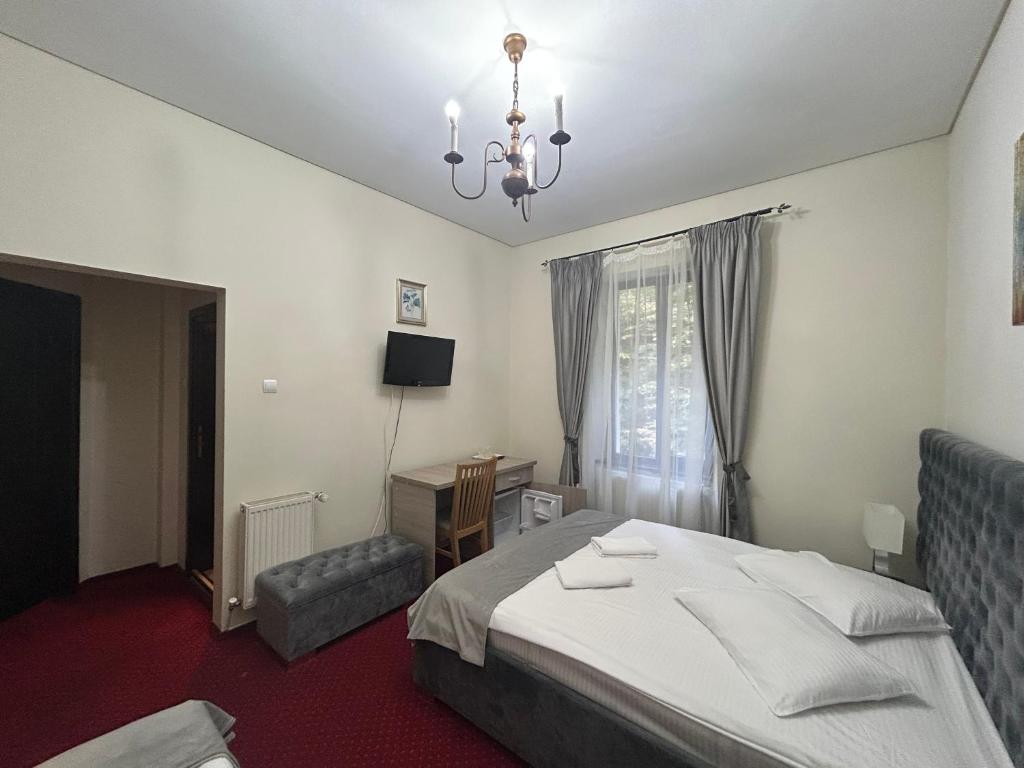 Postel nebo postele na pokoji v ubytování Hotel Stavilar