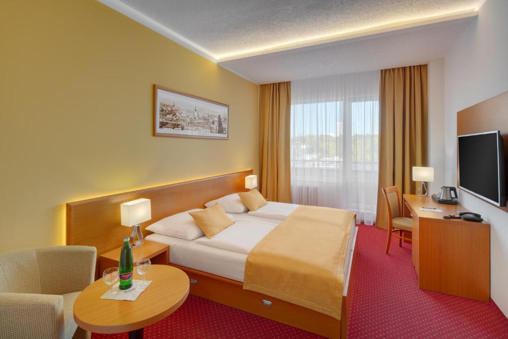 TV a/nebo společenská místnost v ubytování Avanti Hotel