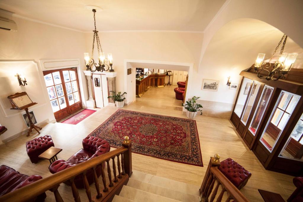 Postel nebo postele na pokoji v ubytování Hotel Gran Duca