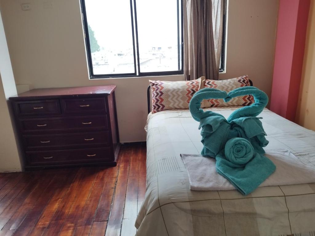 Postel nebo postele na pokoji v ubytování Hostal Terranova Quitumbe