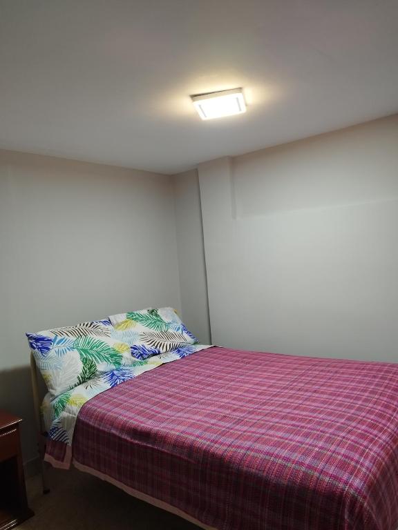 Postel nebo postele na pokoji v ubytování Hostal Terranova Quitumbe