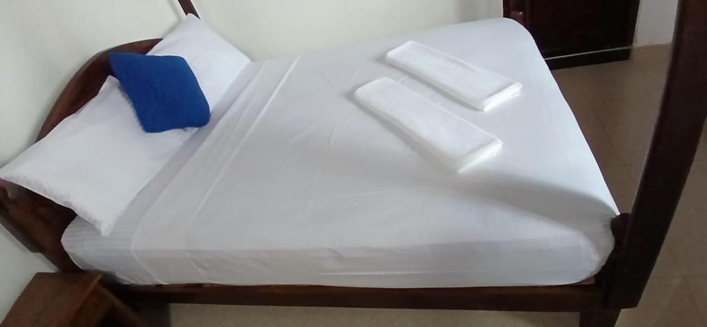 Postel nebo postele na pokoji v ubytování Oviniru Beach Hotel