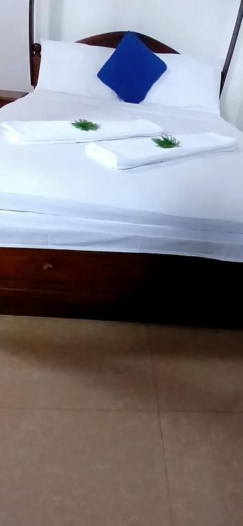Postel nebo postele na pokoji v ubytování Oviniru Beach Hotel