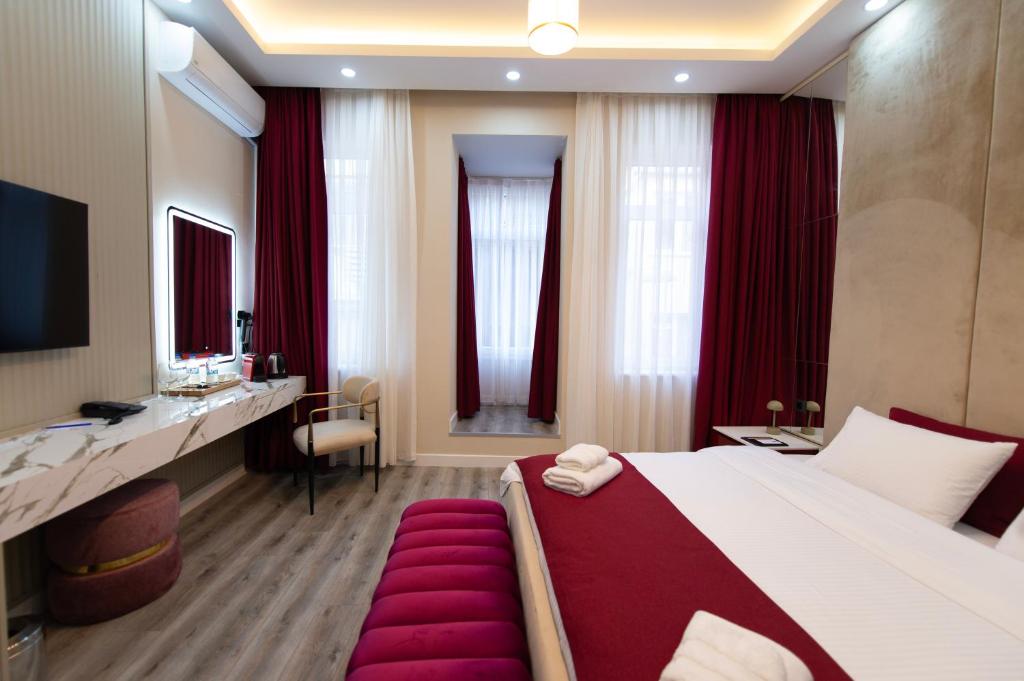 Postel nebo postele na pokoji v ubytování Hidden Pearls Boutique Hotel
