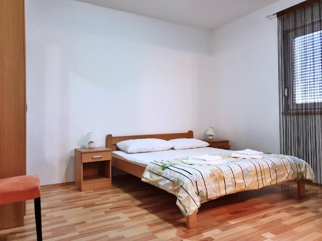 Postel nebo postele na pokoji v ubytování Apartments Rea