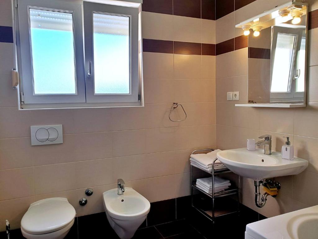 Koupelna v ubytování Apartments Rea